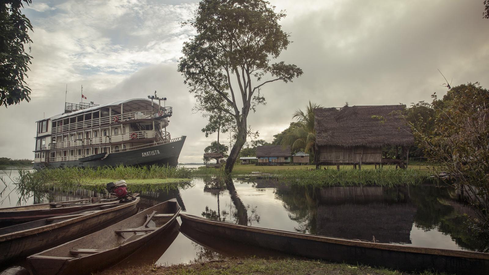 amazon river Riverboat on the amazon with 3 skiffs in the forground